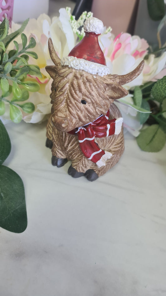 Sitting Highland Cow with Hat & Scarf