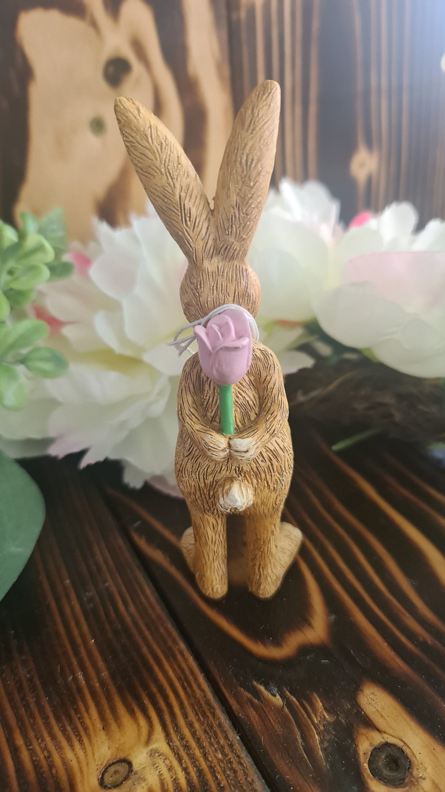 Bunny Holding rose behind Back