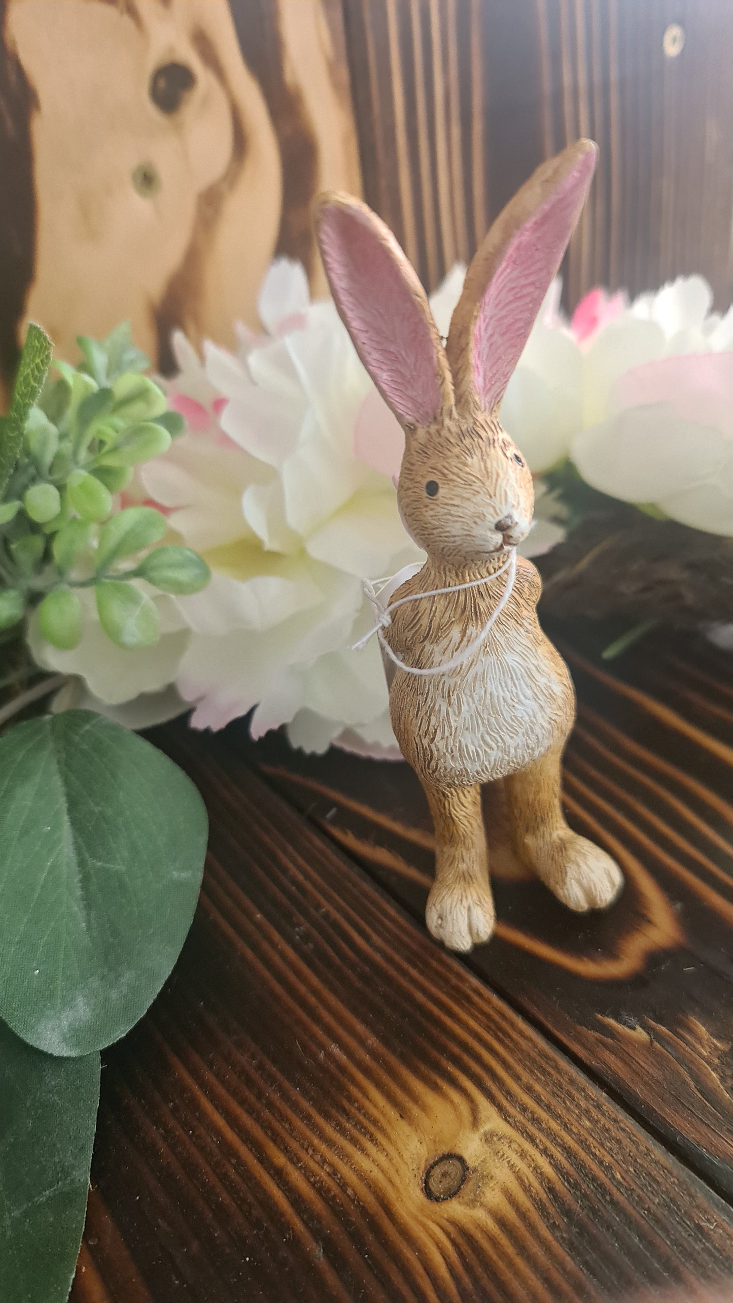 Bunny Holding rose behind Back