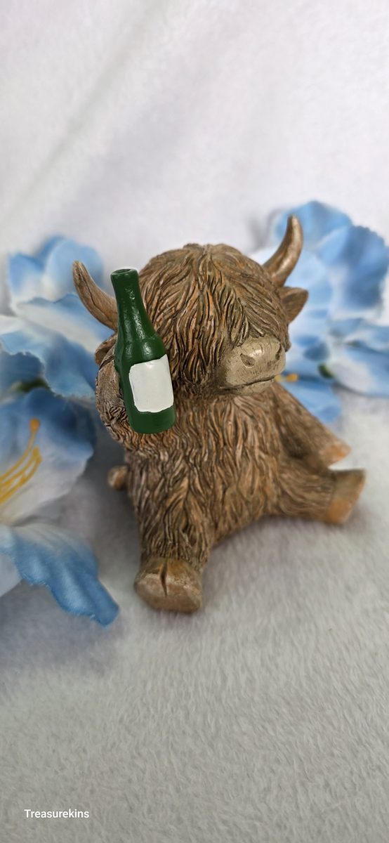 Happy Highland Cow with beer bottle figure