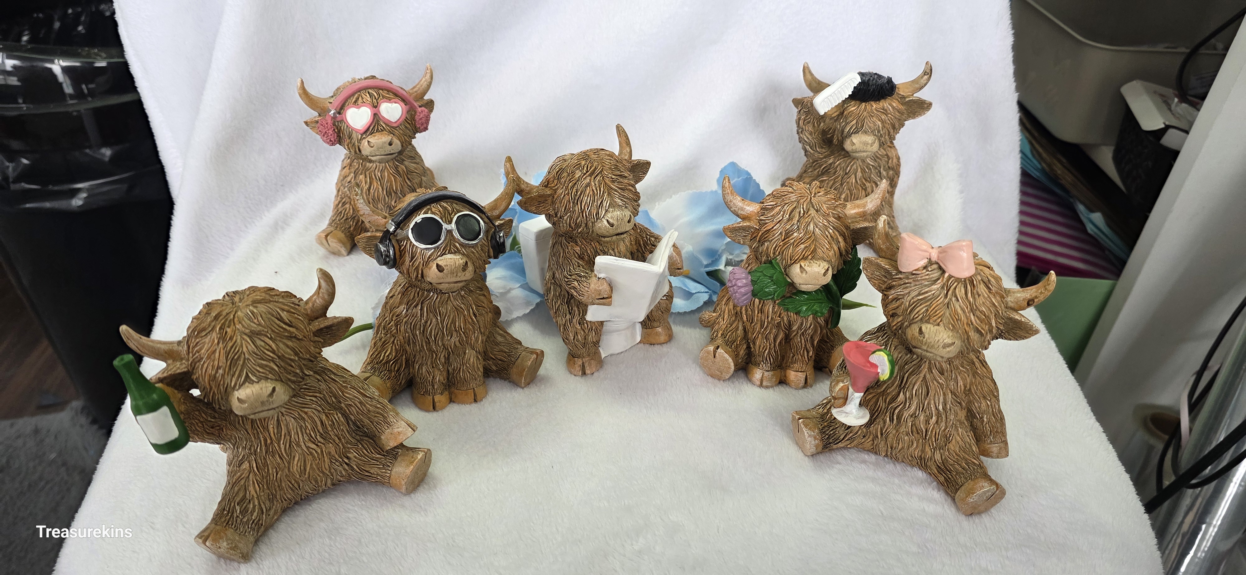 Happy Highland Cow with beer bottle figure